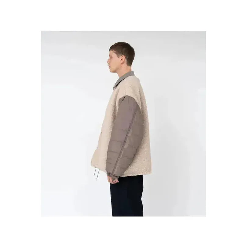 Men's reversible beige wind jacket by nanamica, showing front and back views with lightweight, wind-resistant fabric.