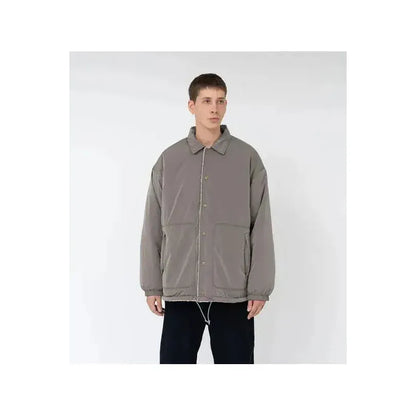 Men's reversible wind jacket in beige by nanamica, showing the outer and inner sides with lightweight, wind-resistant fabric.