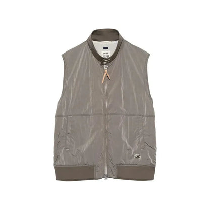 Men's beige nanamica zip-up wind vest with lightweight fabric and stand-up collar, designed for outdoor layering.