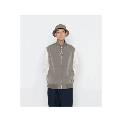 Men's beige nanamica zip-up wind vest with lightweight fabric and a stand-up collar, perfect for outdoor layering.
