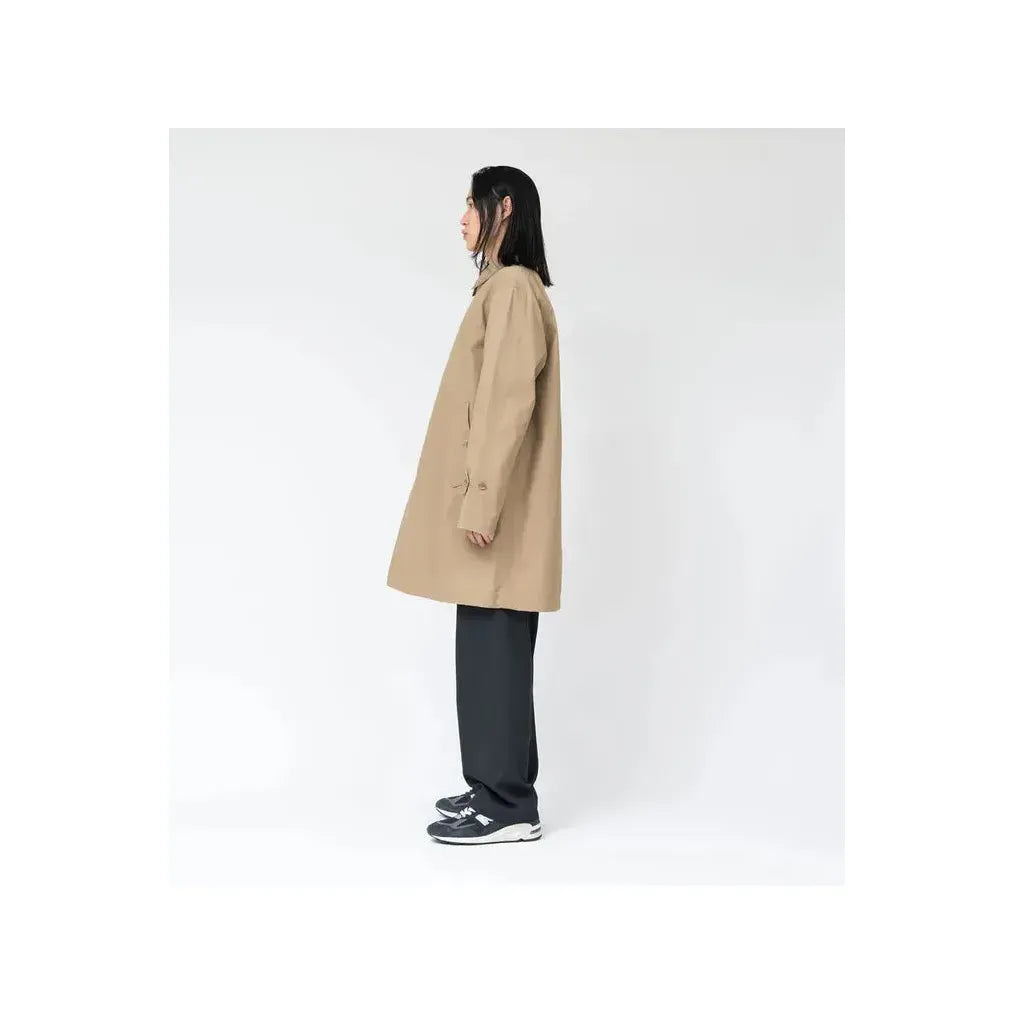 Beige women's GORE-TEX Soutien Collar Coat by nanamica, showing the stylish collar and sleek fabric details.