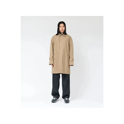 Women's beige nanamica GORE-TEX Soutien Collar Coat showing the collar, waterproof fabric, and tailored fit.