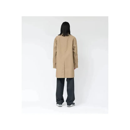 Women's beige nanamica GORE-TEX Soutien Collar Coat showing the collar and front view with a sleek, waterproof design.
