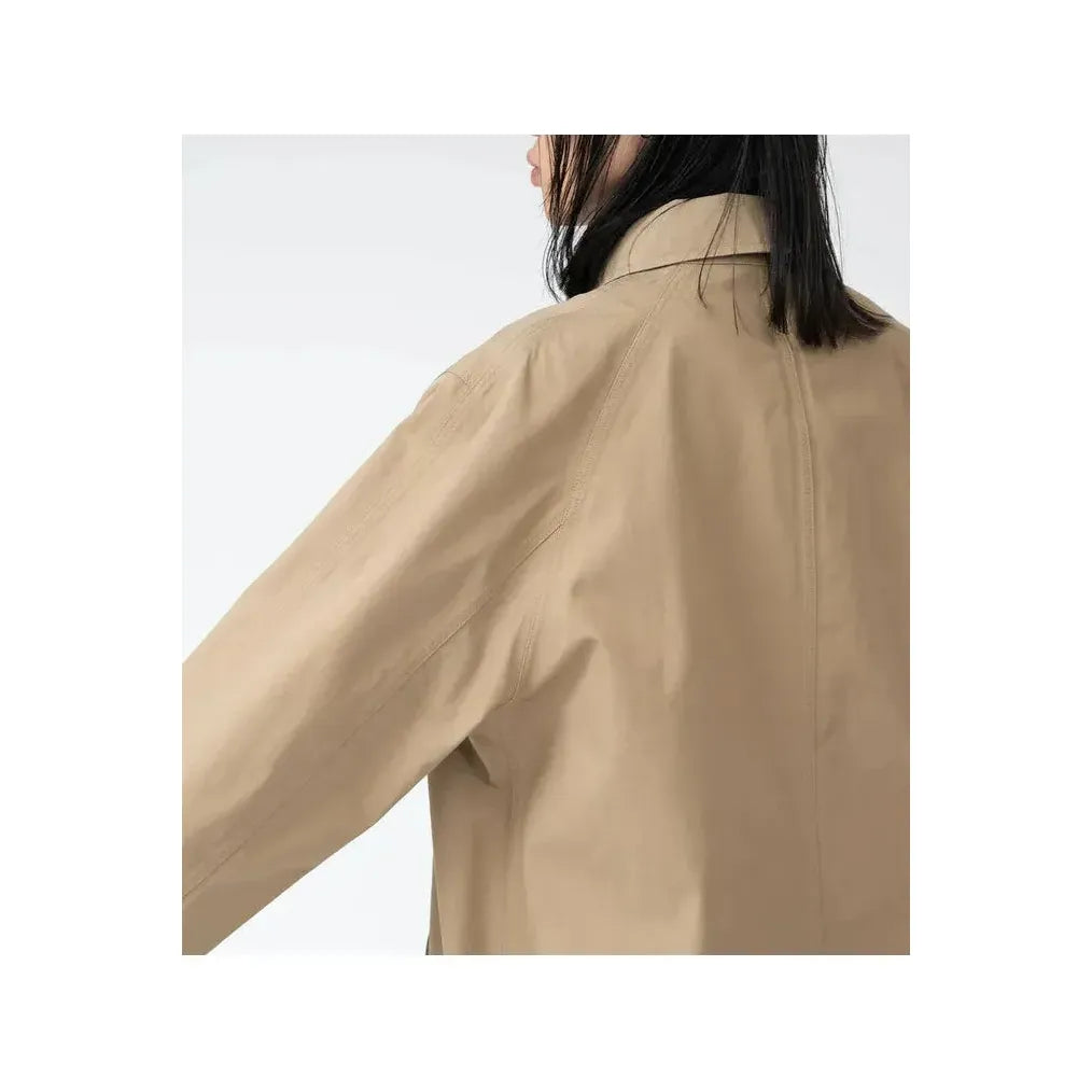 Women's beige nanamica GORE-TEX Soutien Collar Coat, showcasing the stylish collar and waterproof fabric.