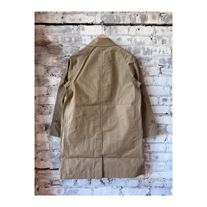 Women's beige GORE-TEX Soutien Collar Coat by nanamica, showing a stylish waterproof outerwear with collar detail and a tailored fit.