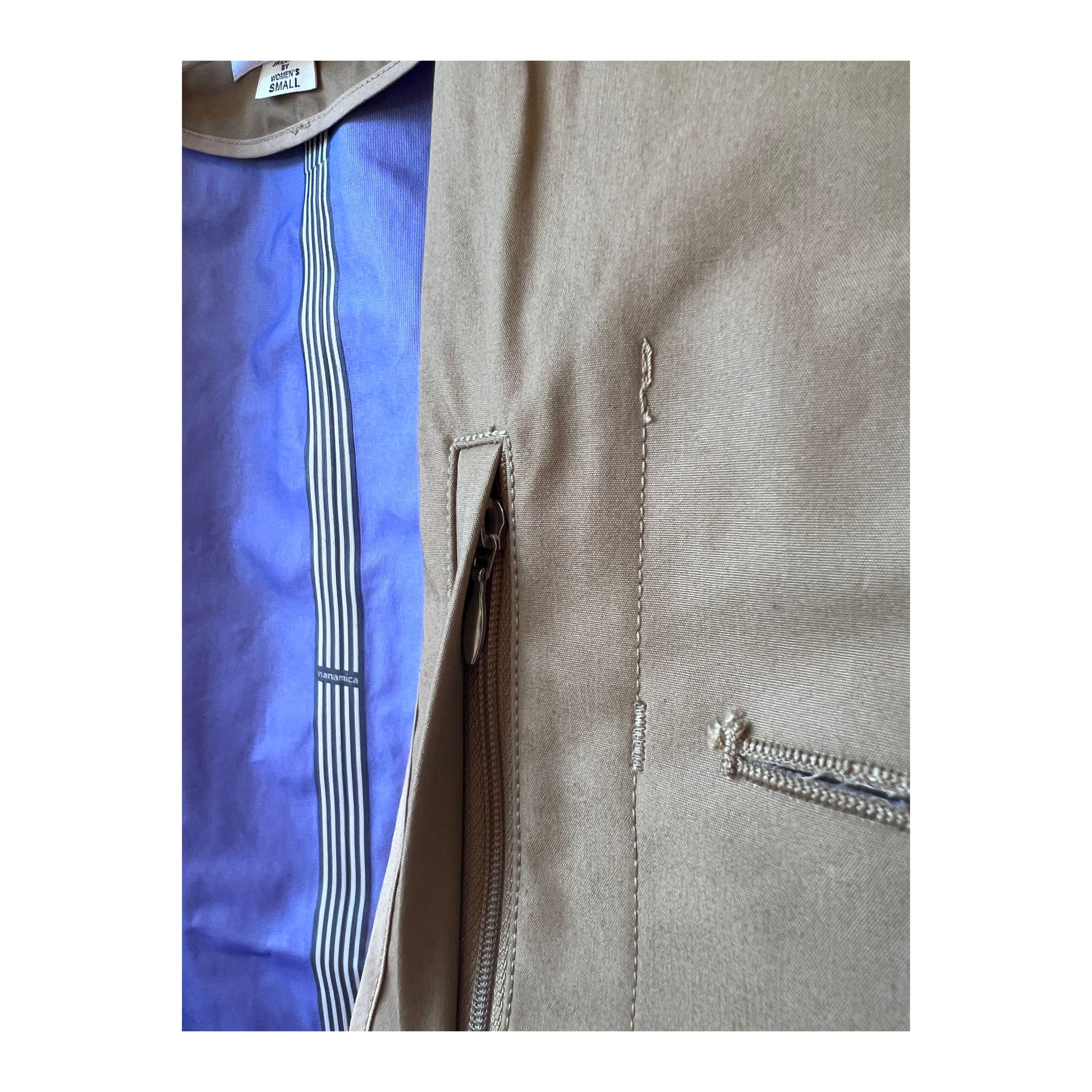 Beige women's GORE-TEX Soutien Collar Coat by nanamica showing the stylish collar and waterproof fabric exterior.
