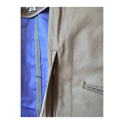 Beige women's GORE-TEX Soutien Collar Coat by nanamica showing the stylish collar and waterproof fabric exterior.