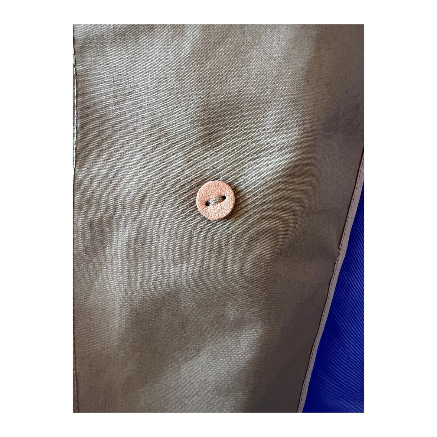 Women's beige nanamica GORE-TEX Soutien Collar Coat showing the stylish collar and waterproof fabric detail.