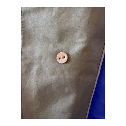 Women's beige nanamica GORE-TEX Soutien Collar Coat showing the stylish collar and waterproof fabric detail.