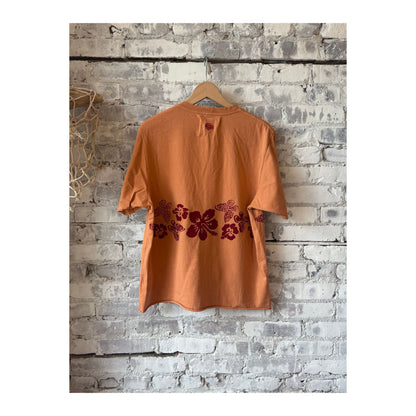 Men's Nectar Raw Hem Tee in Red Earth by MONOSTERO, featuring a casual fit with a raw hem detail and vibrant red color.