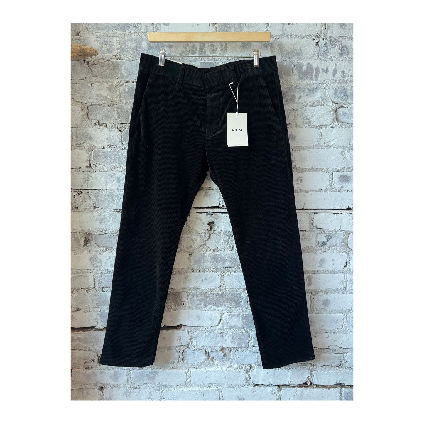 Men's NN07 Theo Classic Slim Cord Chino in Dark Army, showing the tailored fit and fabric detail of the slim chino pants.