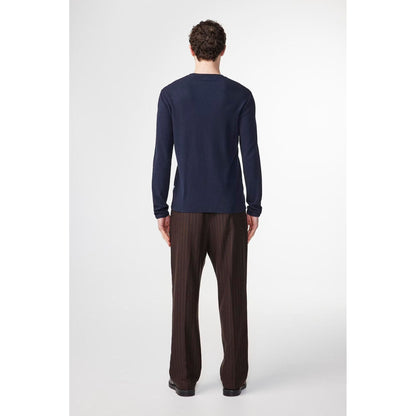 Navy blue NN07 Clive waffle knit men's T-shirt displayed on a hanger, showcasing its textured fabric and casual fit.
