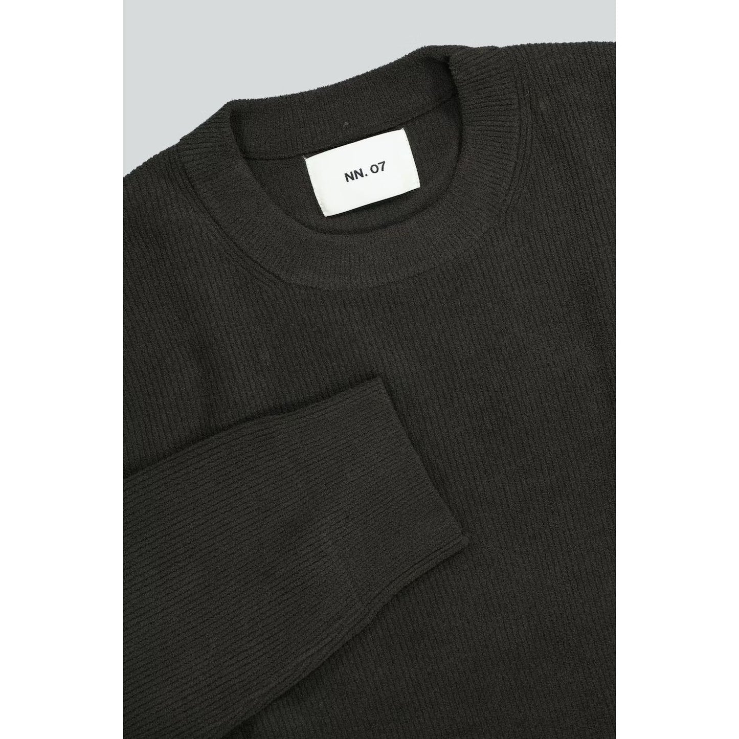 Men's NN07 Danny Sweater in Dark Army, showcasing a close-up of the dark green knit fabric and ribbed collar detail.