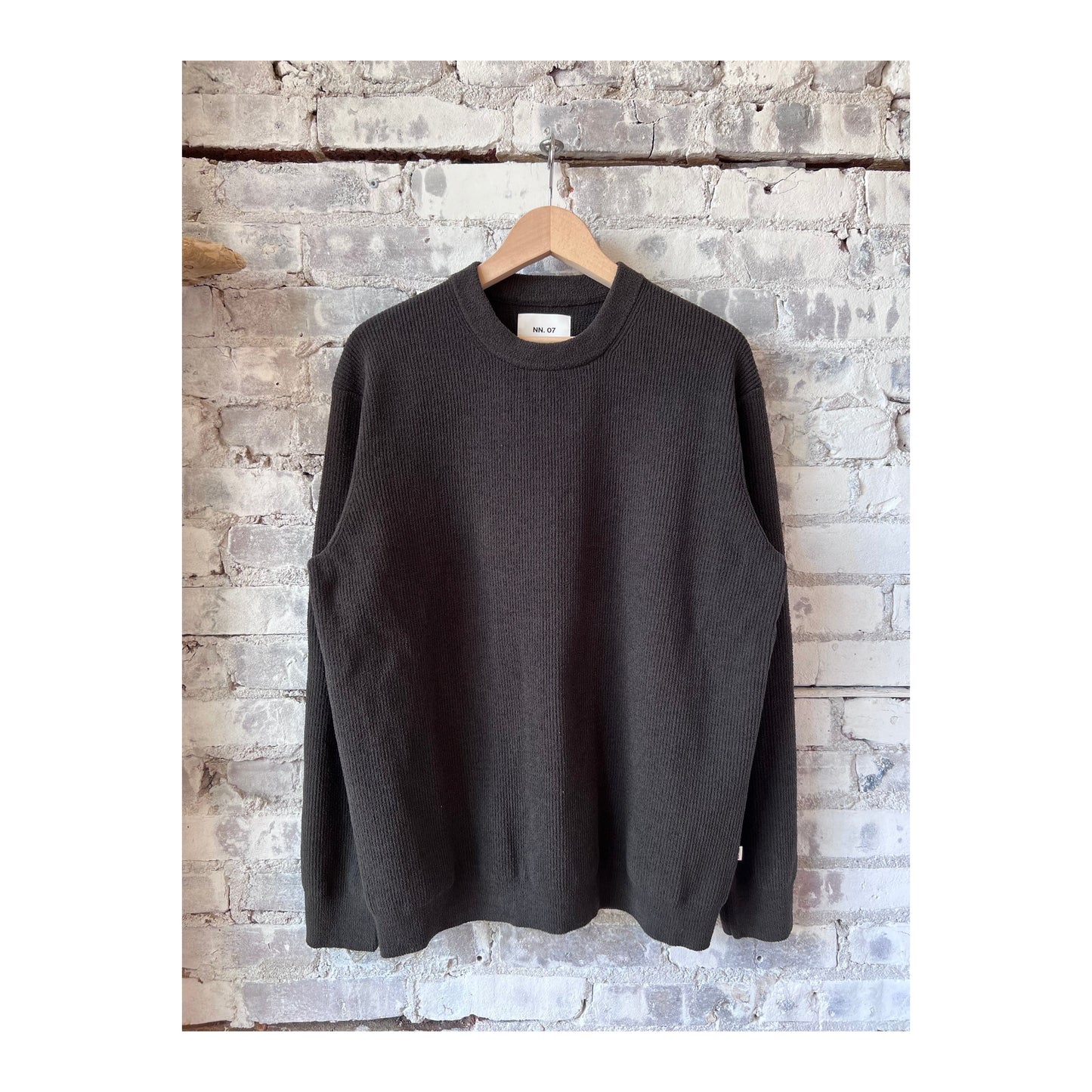 Men's NN07 Danny Sweater in dark army green, knit fabric with a crew neck and long sleeves, displayed on a plain background.