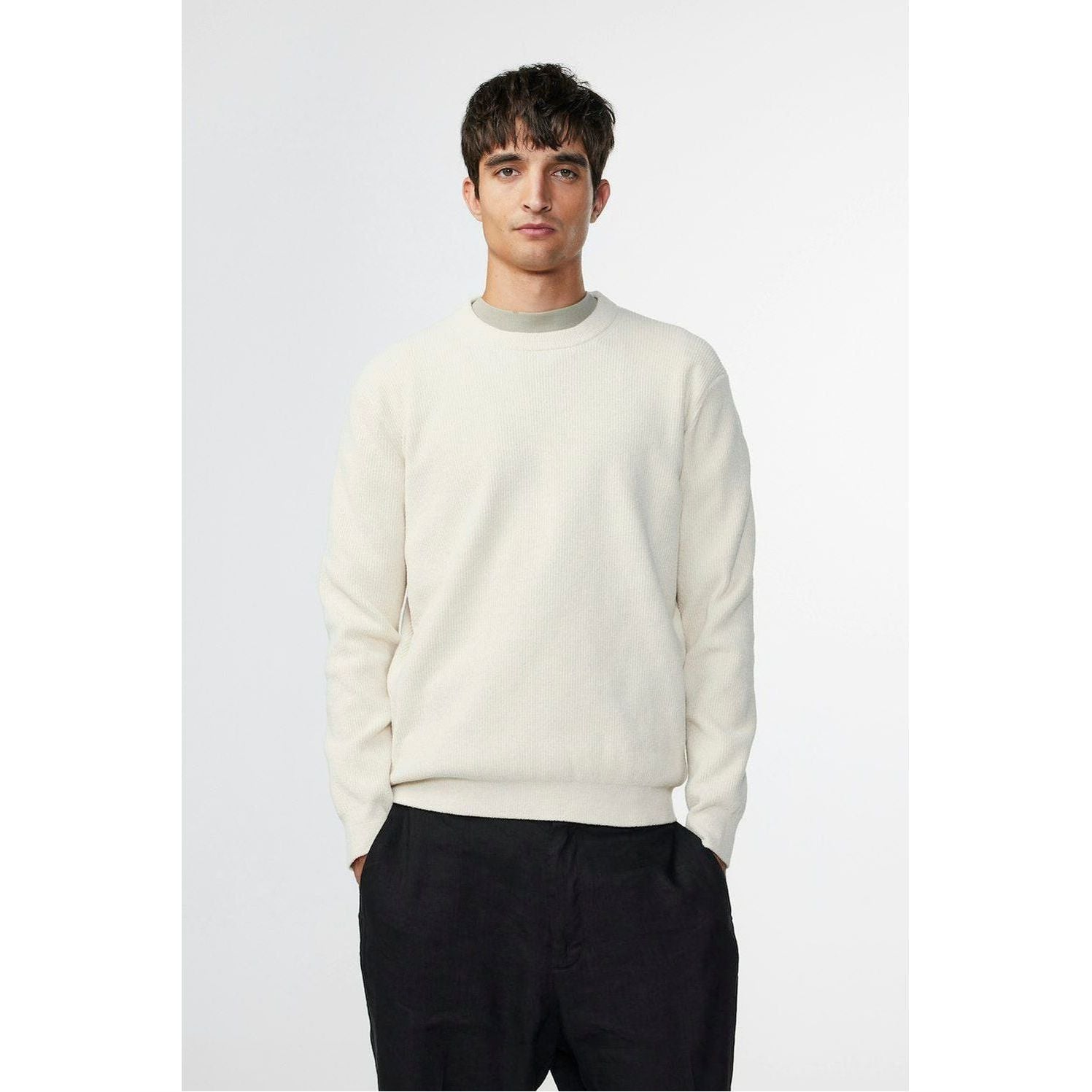 Men's NN07 Danny Sweater in ecru, featuring a cozy knit fabric and classic crewneck design, shown on a model.