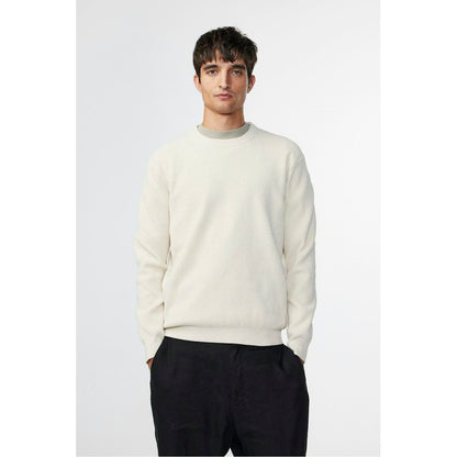 Men's NN07 Danny Sweater in ecru, featuring a cozy knit fabric and classic crewneck design, shown on a model.