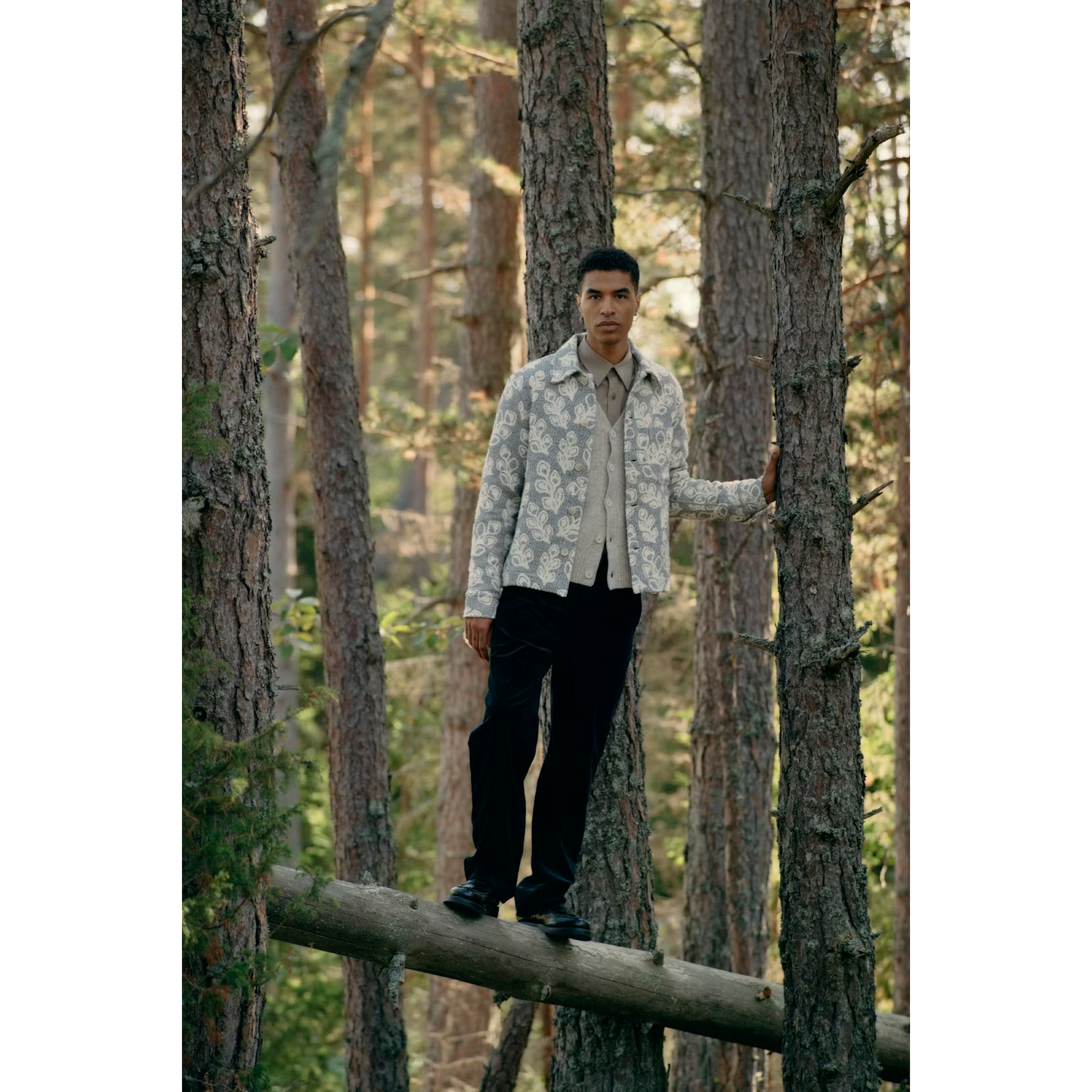 Men's white pepper John V-Neck cardigan by NN07, displayed flat with buttons and ribbed edges, high-quality knit fabric.