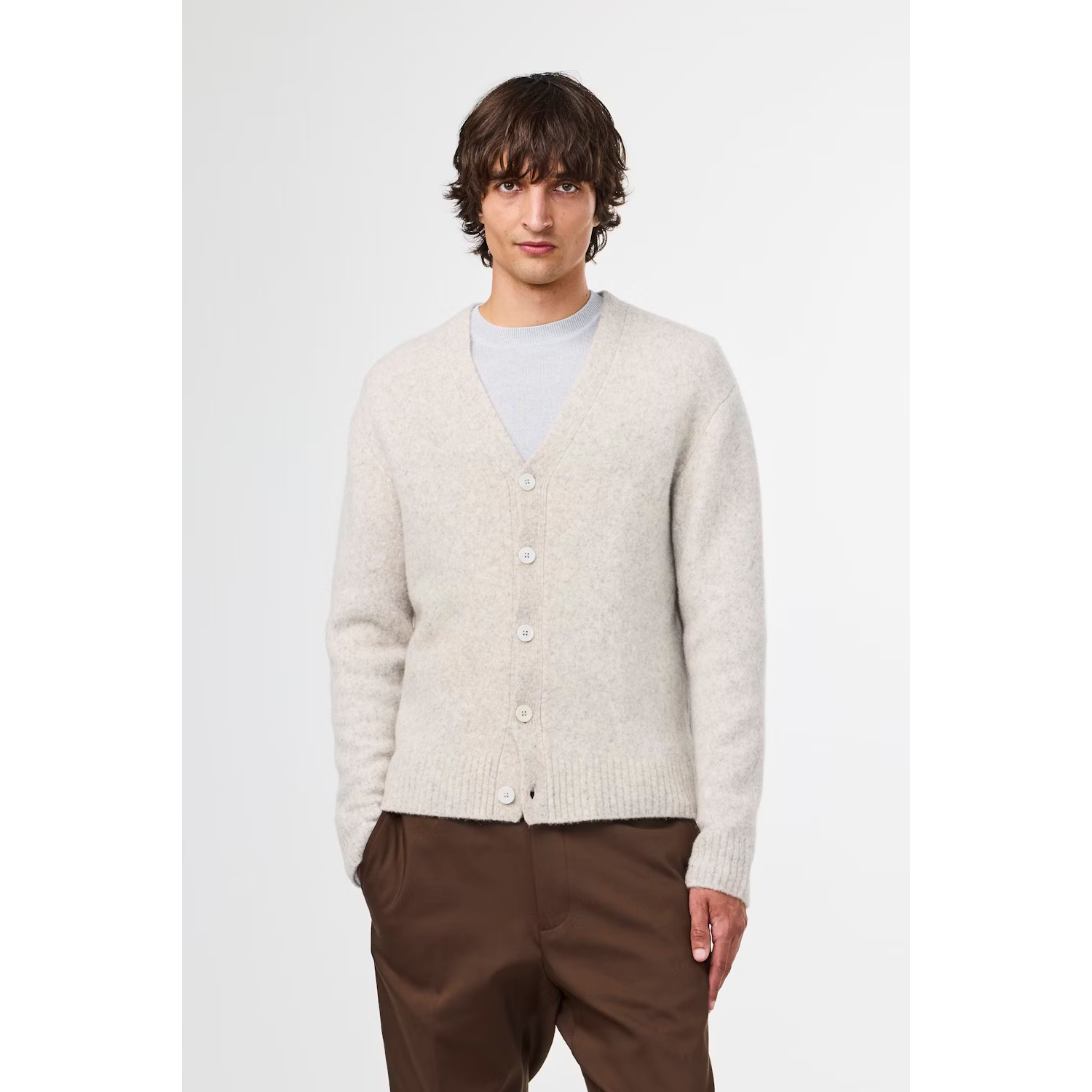 Men's John V-Neck Cardigan in White Pepper by NN07, featuring a close-up of the white knit V-neck sweater.
