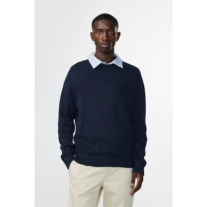 Men's navy Kevin ribbed organic cotton sweater by NN07, featuring a close-up view of the textured knit fabric.