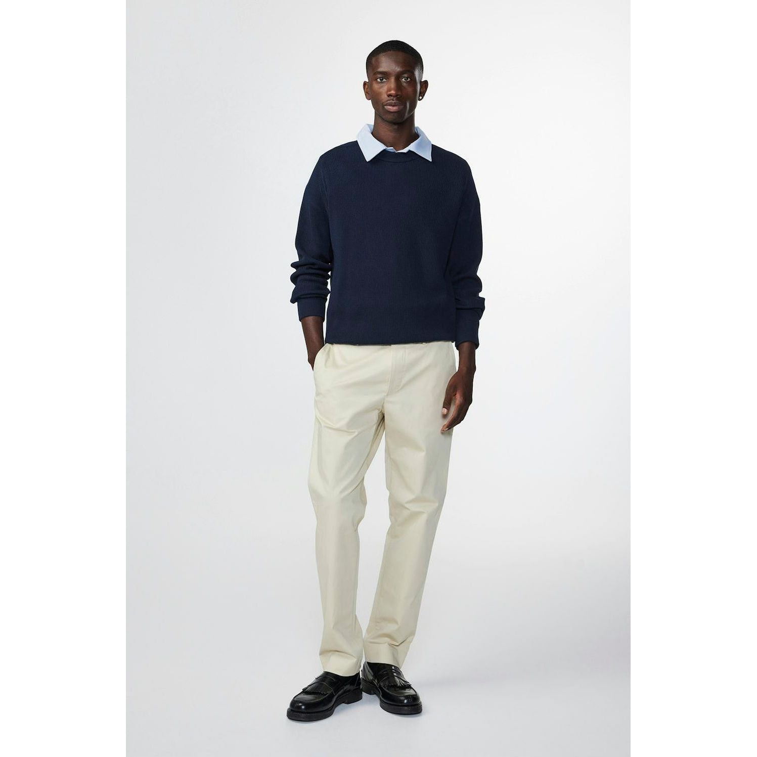 Navy men's Kevin ribbed organic cotton sweater by NN07, featuring a close-up of the textured knit fabric.