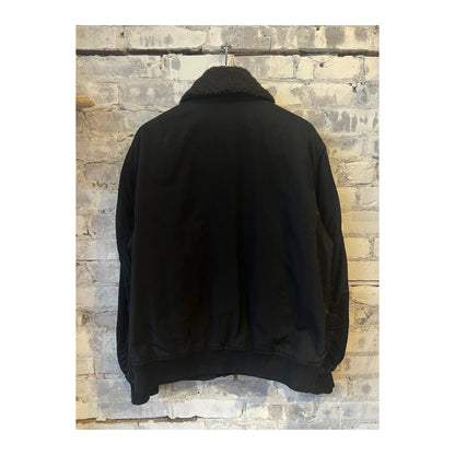 Men's black nylon flight jacket by Closed Men's, featuring a sleek ebony design with a zip-up front and collar.
