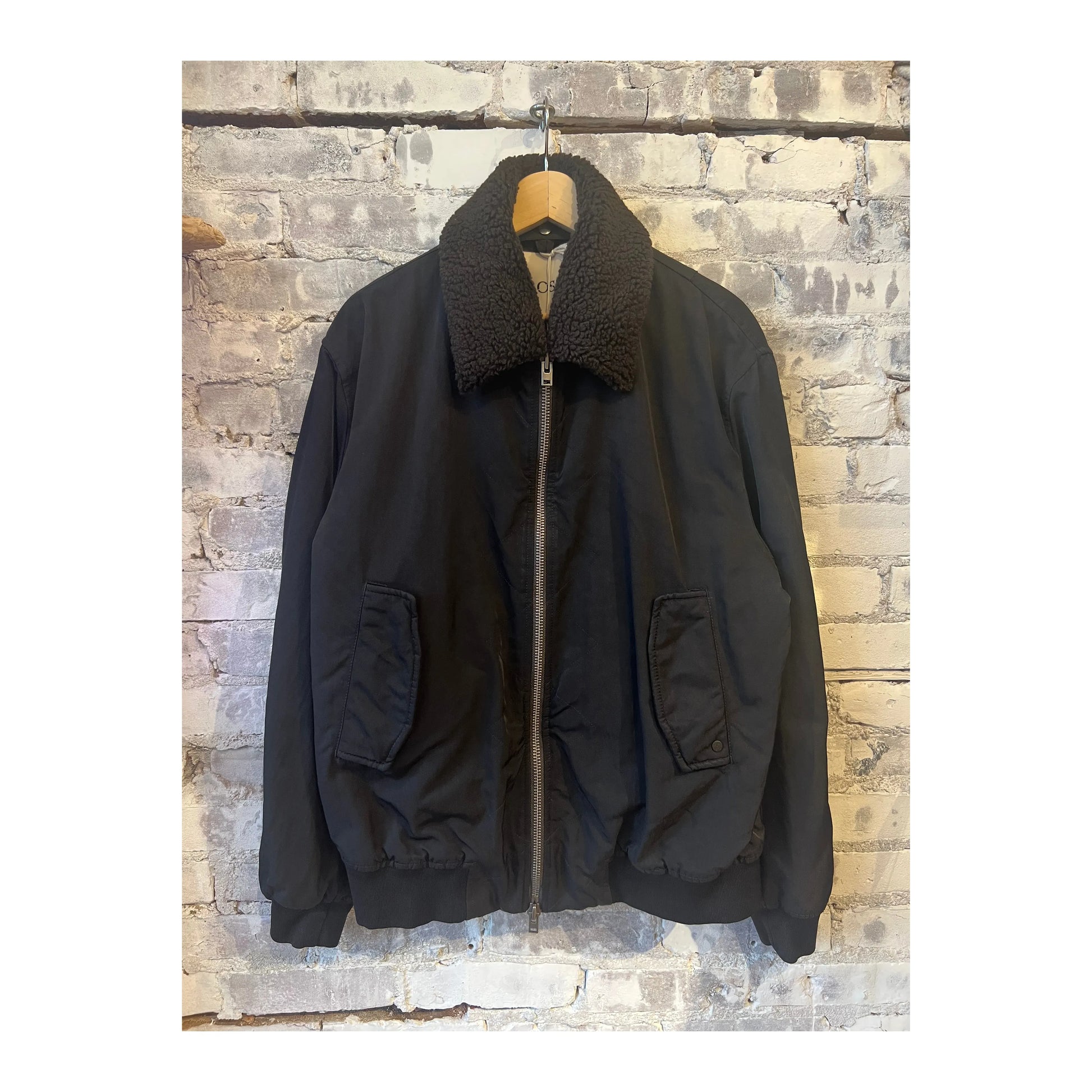 Men's nylon flight jacket in ebony with a sleek design, featuring a front zipper and ribbed cuffs, by Closed Men's.