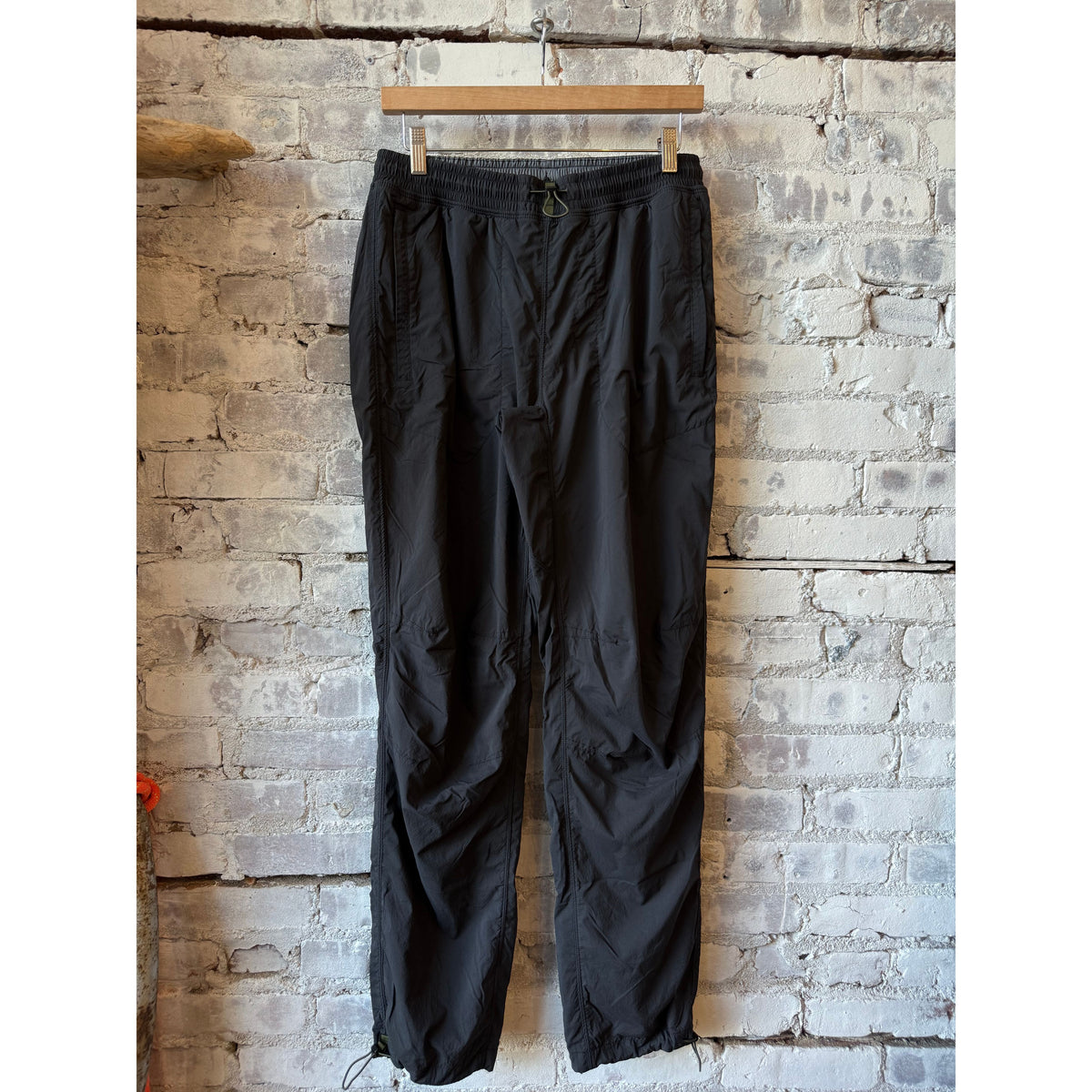 Men's Relwen Off-Trail Windpant in black fade, showing lightweight, breathable fabric and adjustable waistband for outdoor activities.