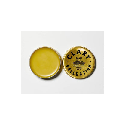 Clary Collection Olive Balm 2oz jar, a natural skincare accessory with a black lid and green label, close-up view.