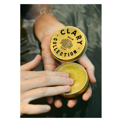 Clary Collection Olive Balm 2oz jar, natural skincare accessory with a green olive-themed label and silver lid.