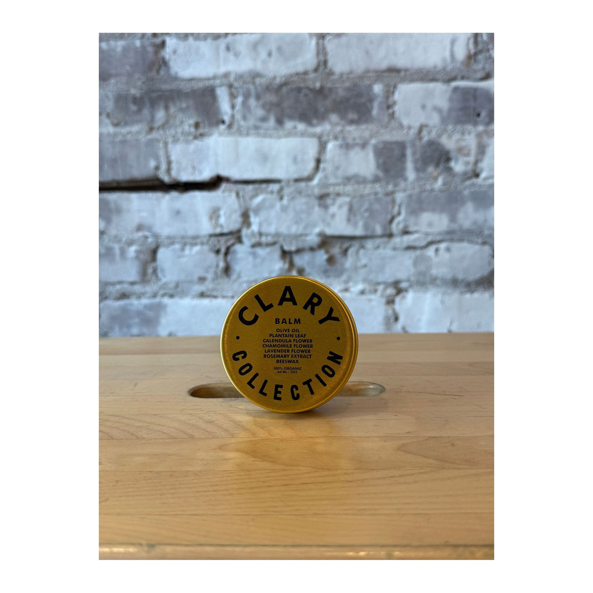 Clary Collection Olive Balm in 2oz jar, a natural skincare accessory with a soothing olive-based formula.