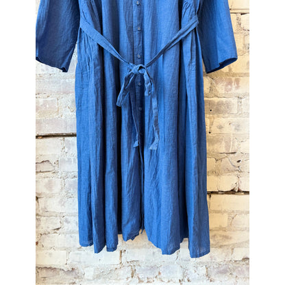 Women's organic cotton chambray dress in cobalt by Pas De Calais, featuring a relaxed fit and classic button-down style.
