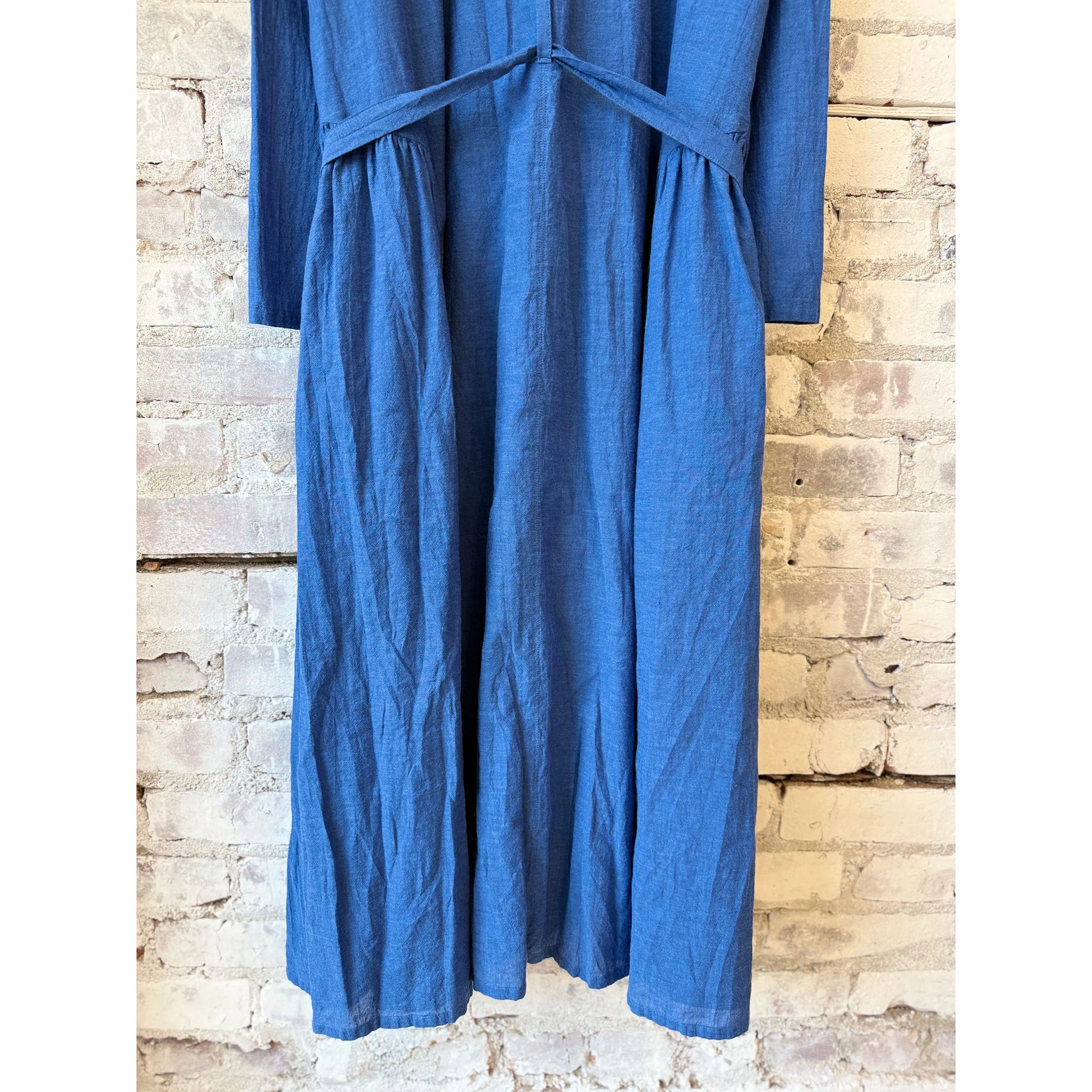 Women's organic cotton chambray dress in cobalt by Pas De Calais, featuring a relaxed fit and classic button-down style.