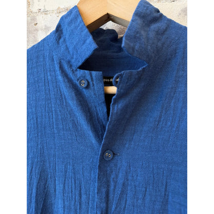 Women's organic cotton chambray dress in cobalt by Pas De Calais, featuring a relaxed fit and button-front design.