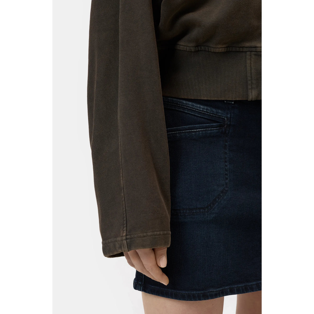 Women's organic cotton jacket in brown, stylish and eco-friendly, with a relaxed fit and natural fabric texture.