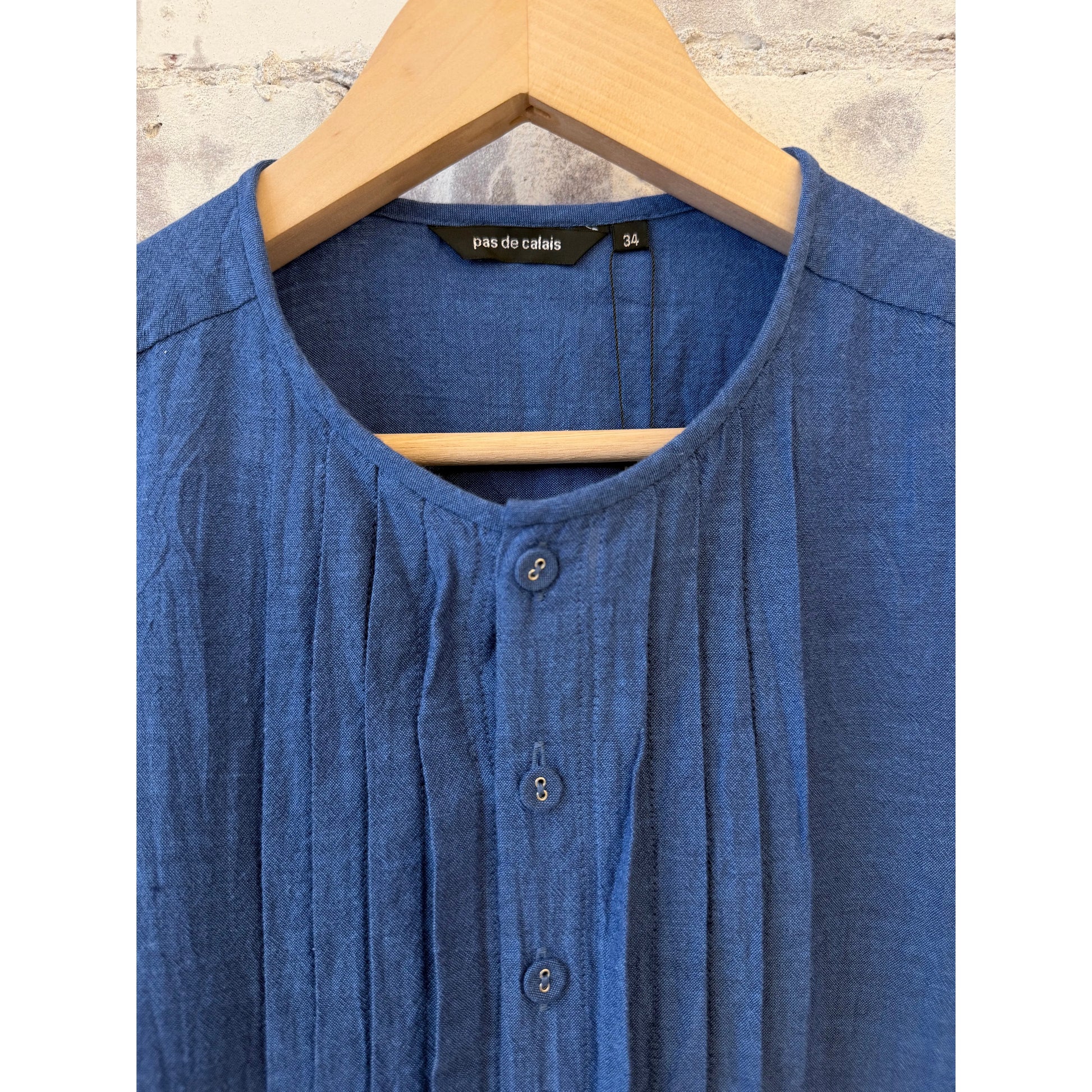 Women's organic cotton pleated blouse in cobalt by Pas De Calais, featuring a stylish pleated design and comfortable fit.