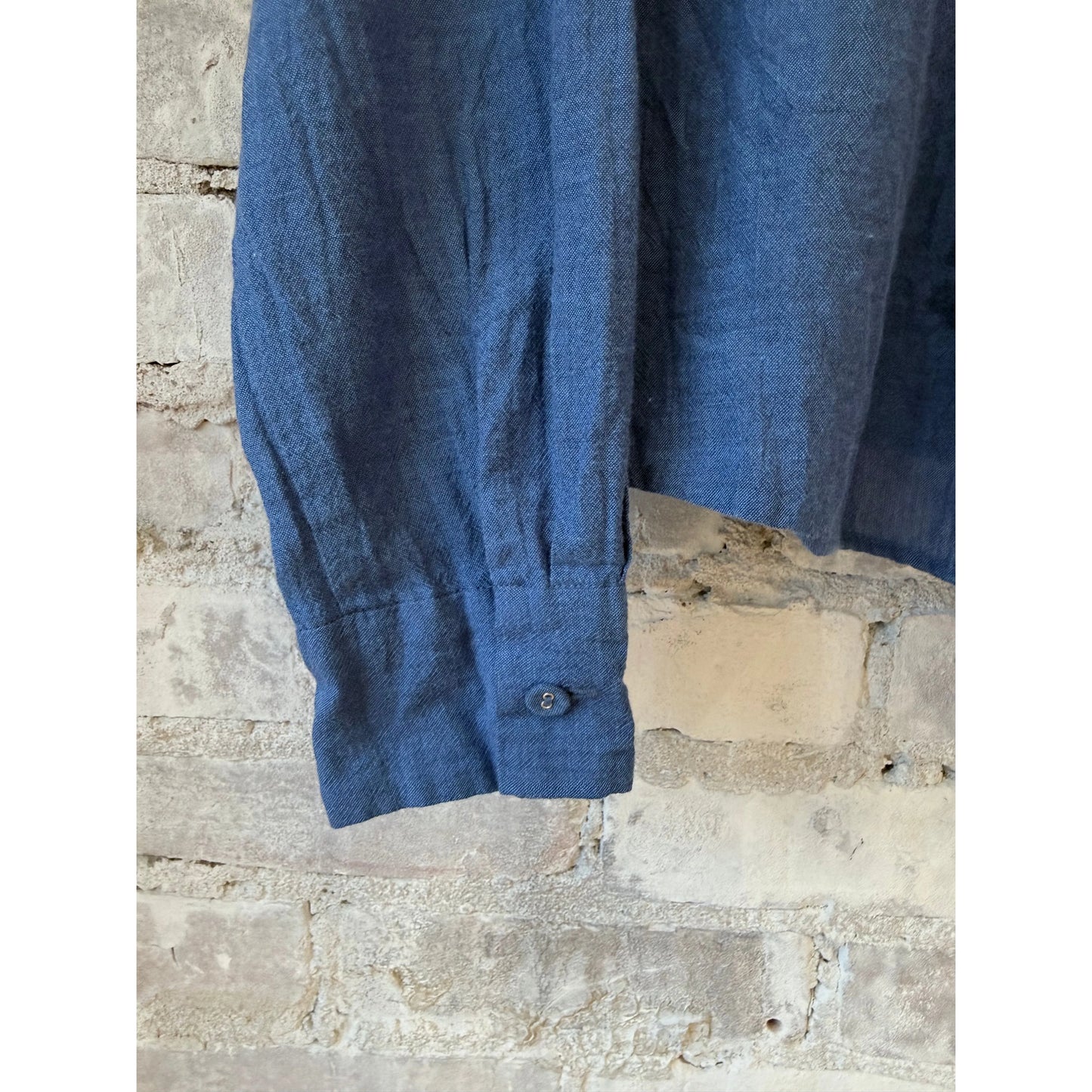 Women's organic cotton pleated blouse in cobalt by Pas De Calais, featuring a stylish, lightweight design with pleated details.