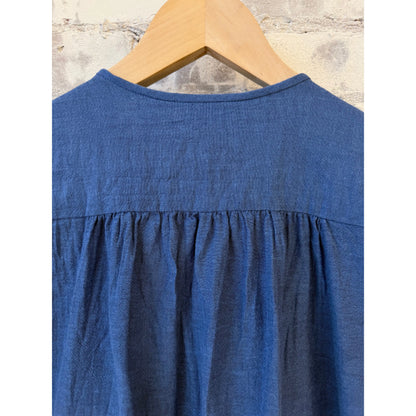 Women's organic cotton pleated blouse in cobalt by Pas De Calais, featuring a stylish, flowing design and pleated details.