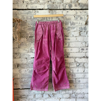 Women's Freecity pink kite pant with poplin fabric, air flap, and snap closure, featuring a stylish pink plant design.