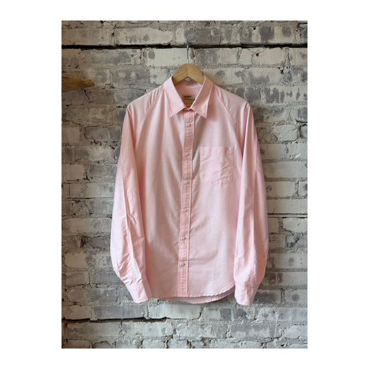 Men's pink Oxford shirt by Heimat, showcasing the classic collar and button-down front on a white background.