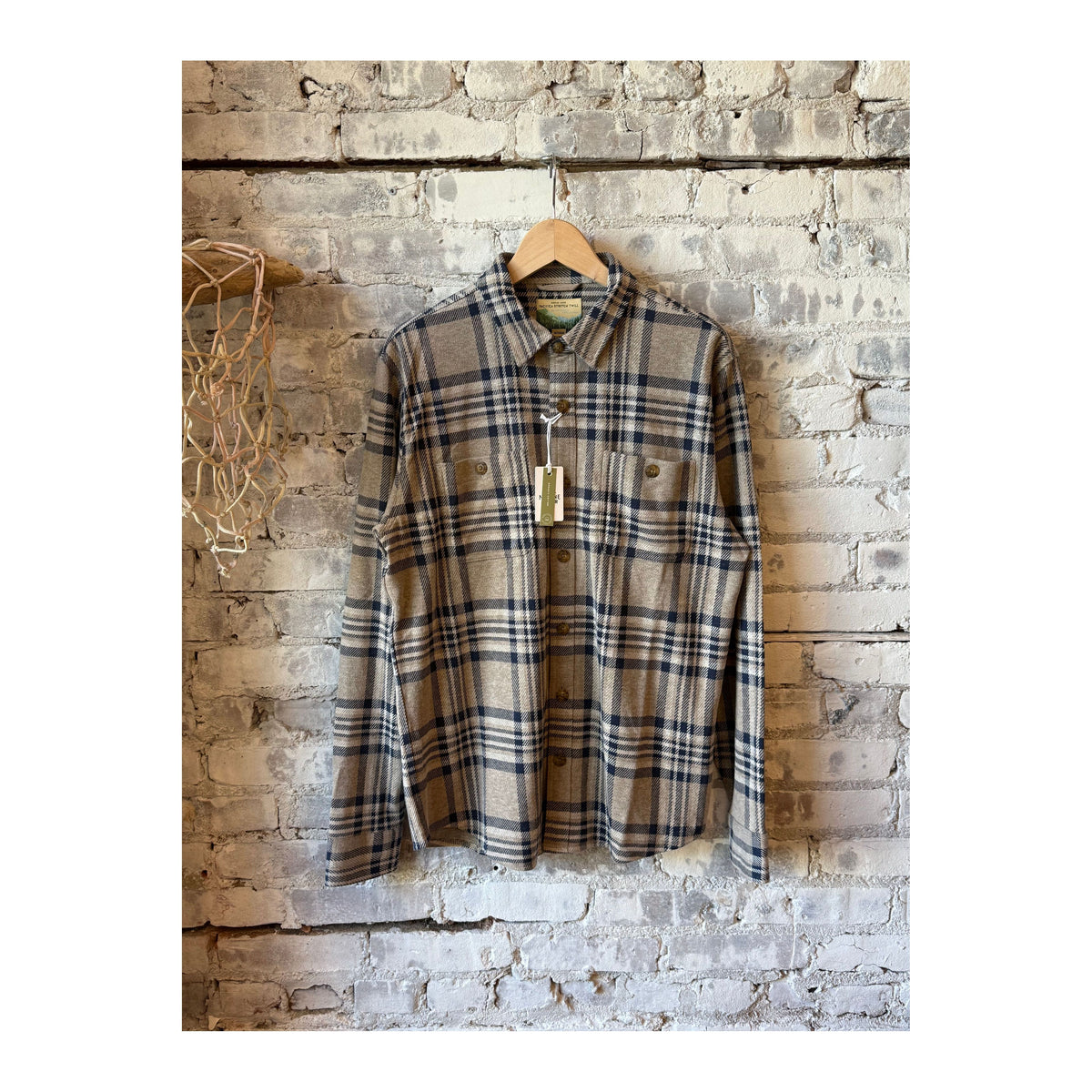 Men's Marine Layer Pacifica Stretch Twill Overshirt in taupe plaid fabric, showing the button-up front and classic plaid pattern.