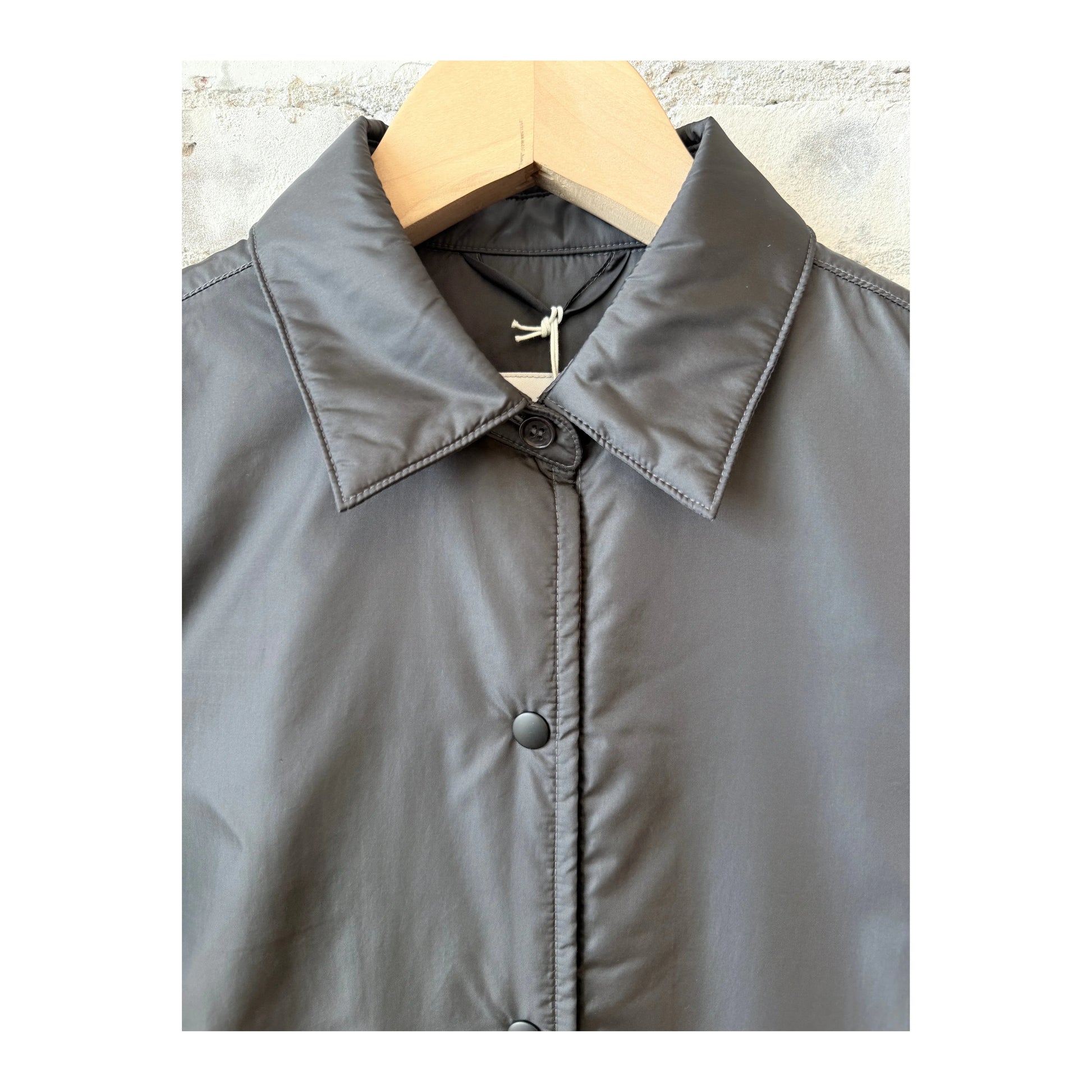 Women's grey padded nylon overshirt by Aspesi, featuring a relaxed fit and quilted design, ideal for casual layering.