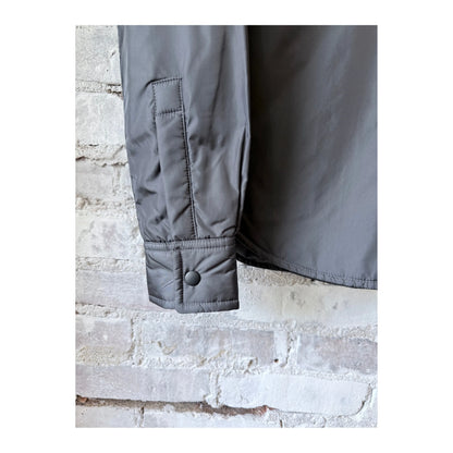 Women's grey padded nylon overshirt by Aspesi, featuring a relaxed fit and lightweight, comfortable design.