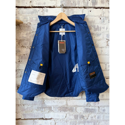 Women's light blue padded nylon overshirt by Aspesi, featuring a padded design and casual overshirt style.
