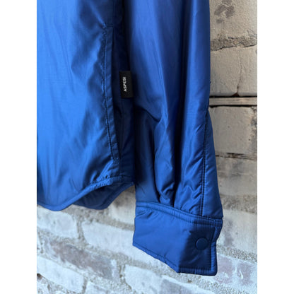 Light blue women's padded nylon overshirt by Aspesi featuring a relaxed fit and padded design for casual wear.