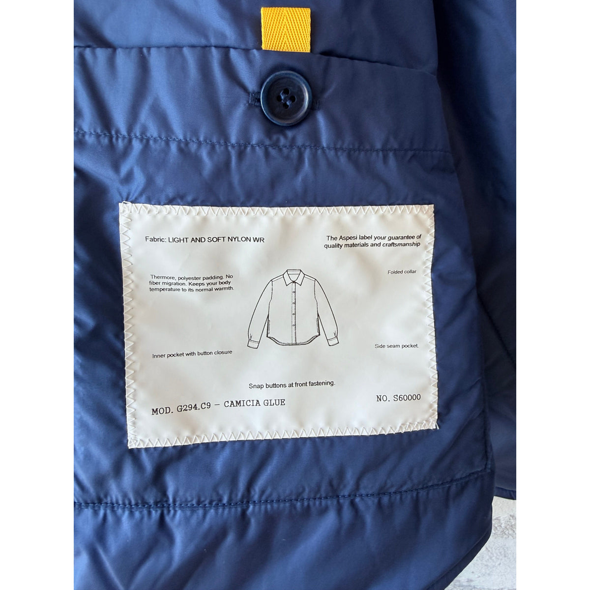 Light blue women's padded nylon overshirt by Aspesi, featuring a comfortable, stylish design with quilted padding.