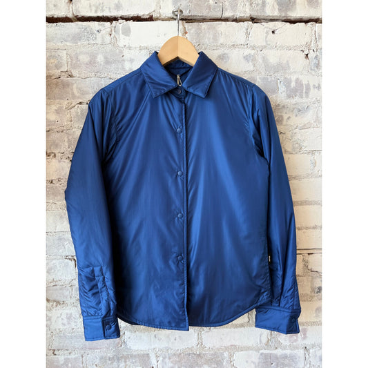 Light blue women's padded nylon overshirt by Aspesi, showing a stylish, lightweight outerwear piece with padded detailing.
