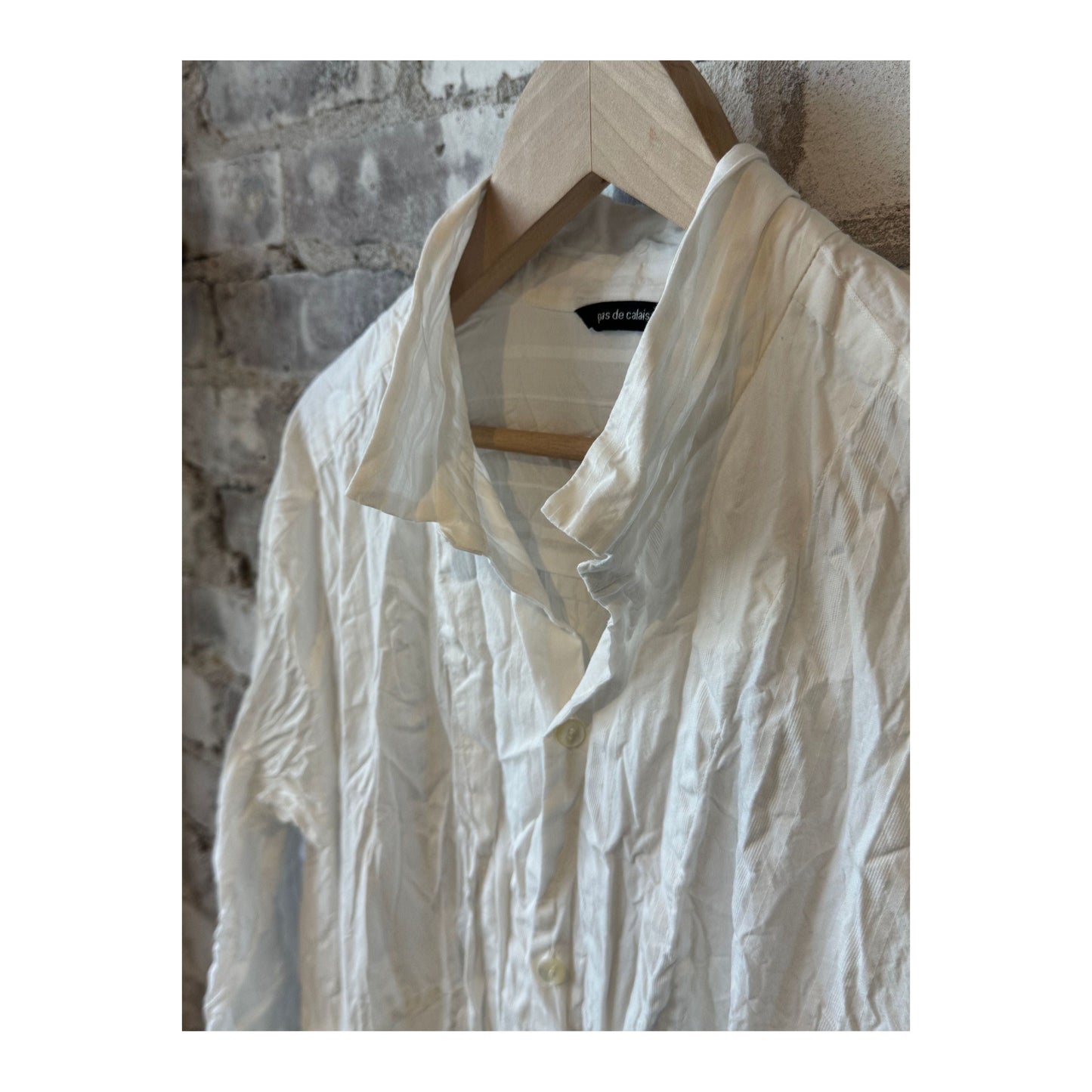 Women's white cotton dobby shirt dress by Pas De Calais, featuring a classic button-up design and tailored fit.
