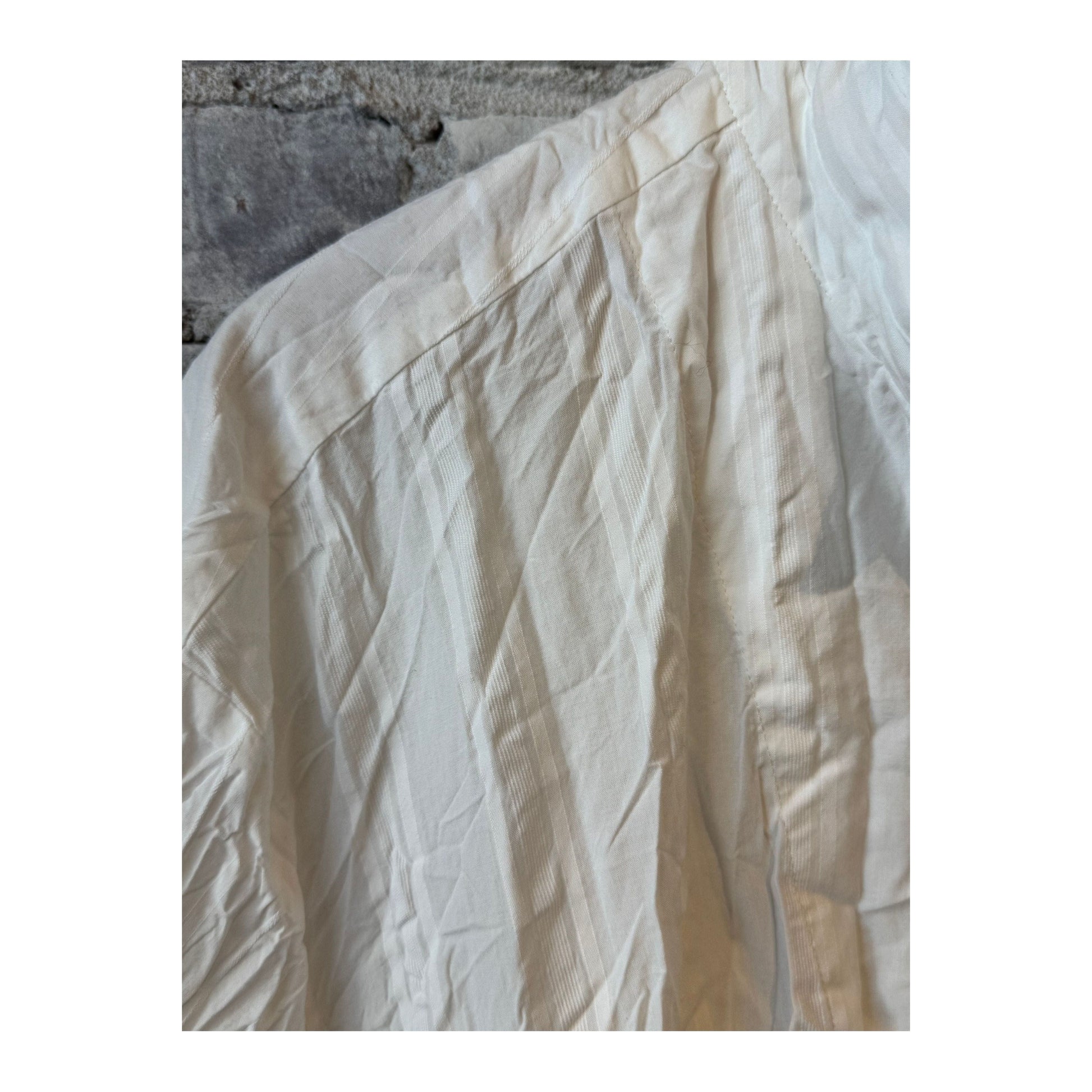 Women's white cotton dobby shirt dress by Pas De Calais, featuring a relaxed fit with button-front and classic collar details.