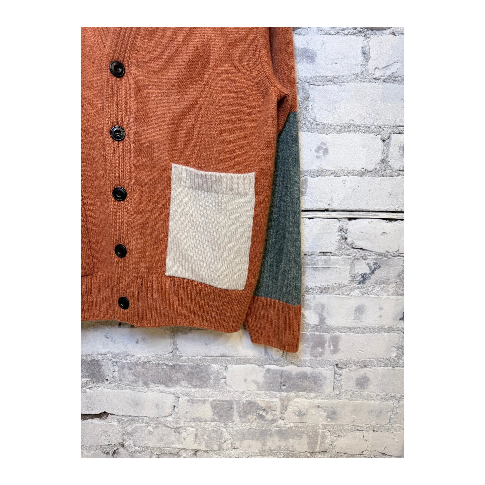 Burn orange mix women's cashmere cardigan with patch and pocket details by Freecity, showcasing soft knit fabric and stylish design.