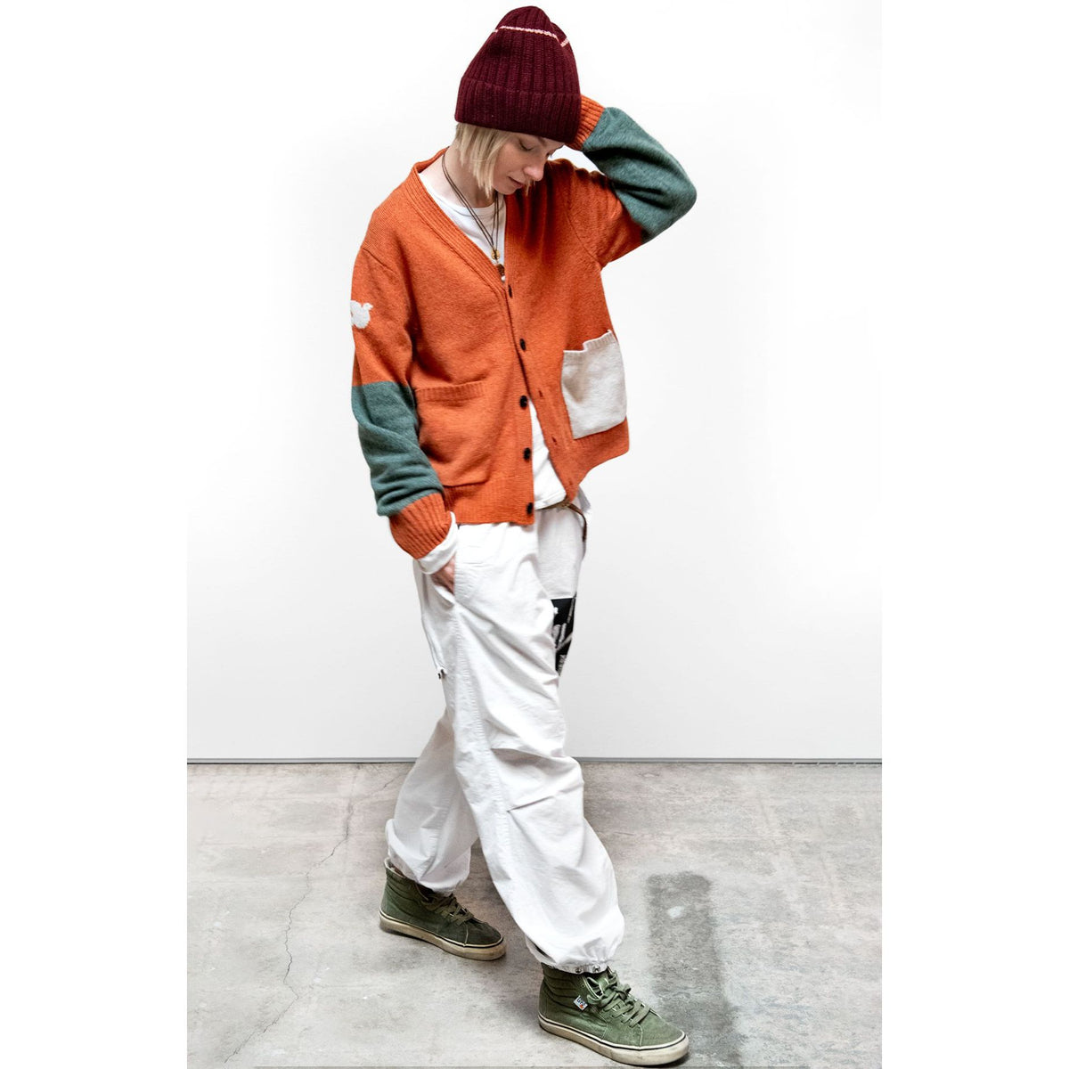 Women's Burn Orange Mix Cashmere Lux Cardigan by Freecity, featuring patch pockets and a soft, cozy texture.